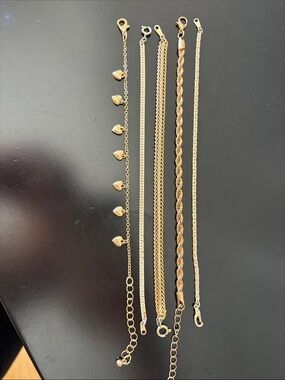 Set of 5 stackable gold tone bracelets